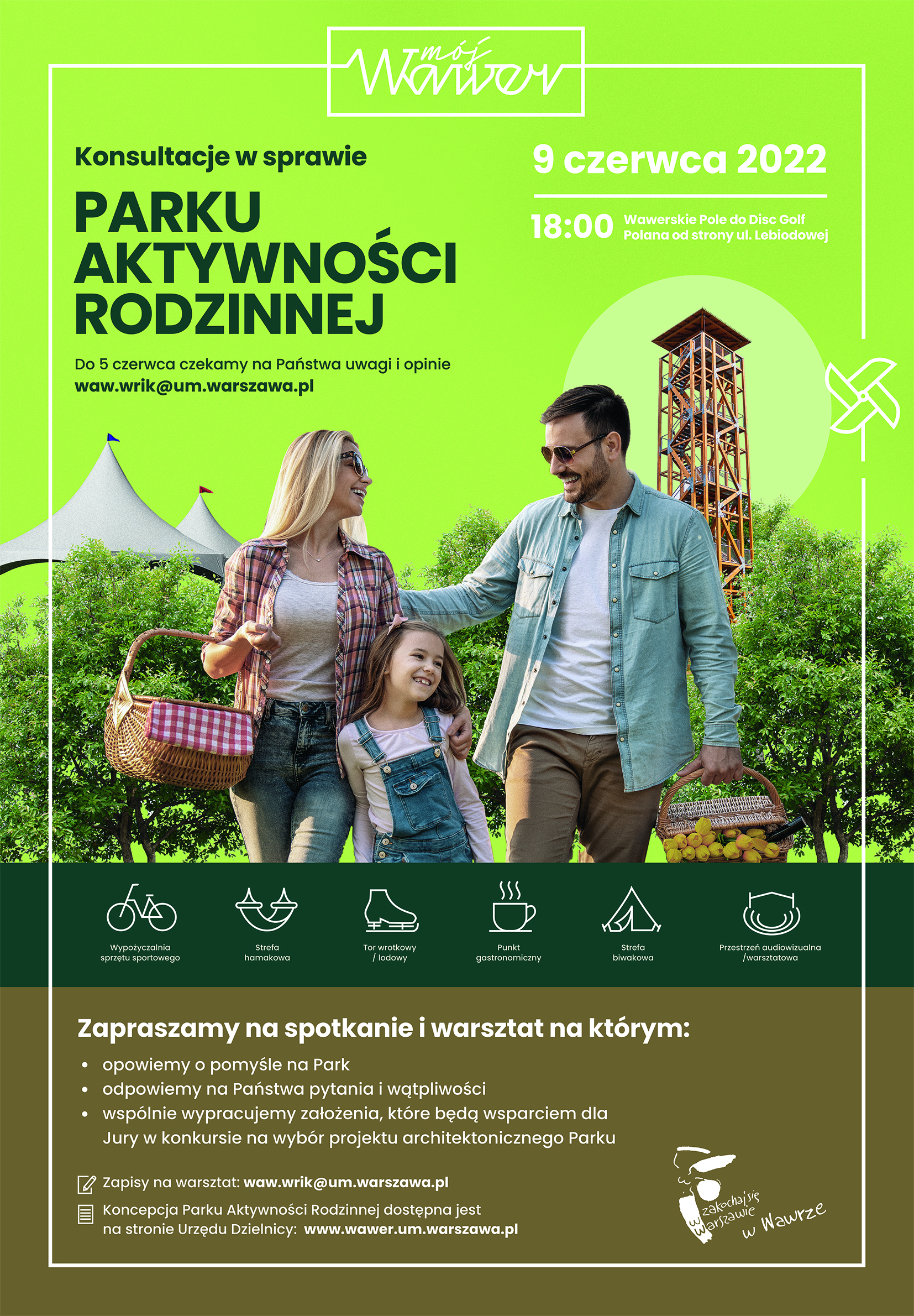 Rodzina z dzieckiem i koszem piknikowym na tle wieży widokowej